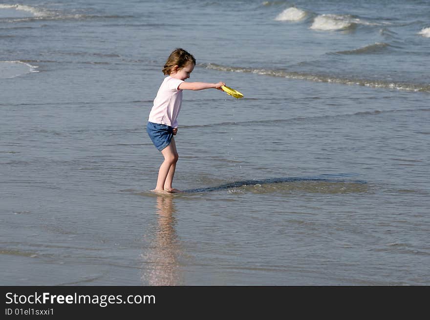 Little girl getting wet and playing in surf. Little girl getting wet and playing in surf