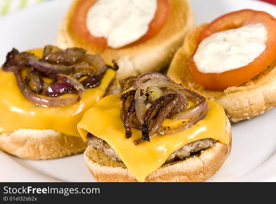 Cheeseburger with fried onions tomato and white sauce. Cheeseburger with fried onions tomato and white sauce