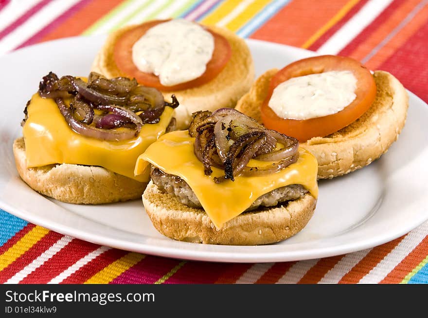 Cheeseburger with fried onions tomato and white sauce. Cheeseburger with fried onions tomato and white sauce