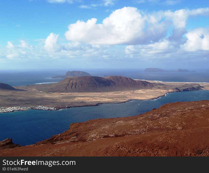 View of smaller volcanic Canary Islands off northwest tip of Lanzorote