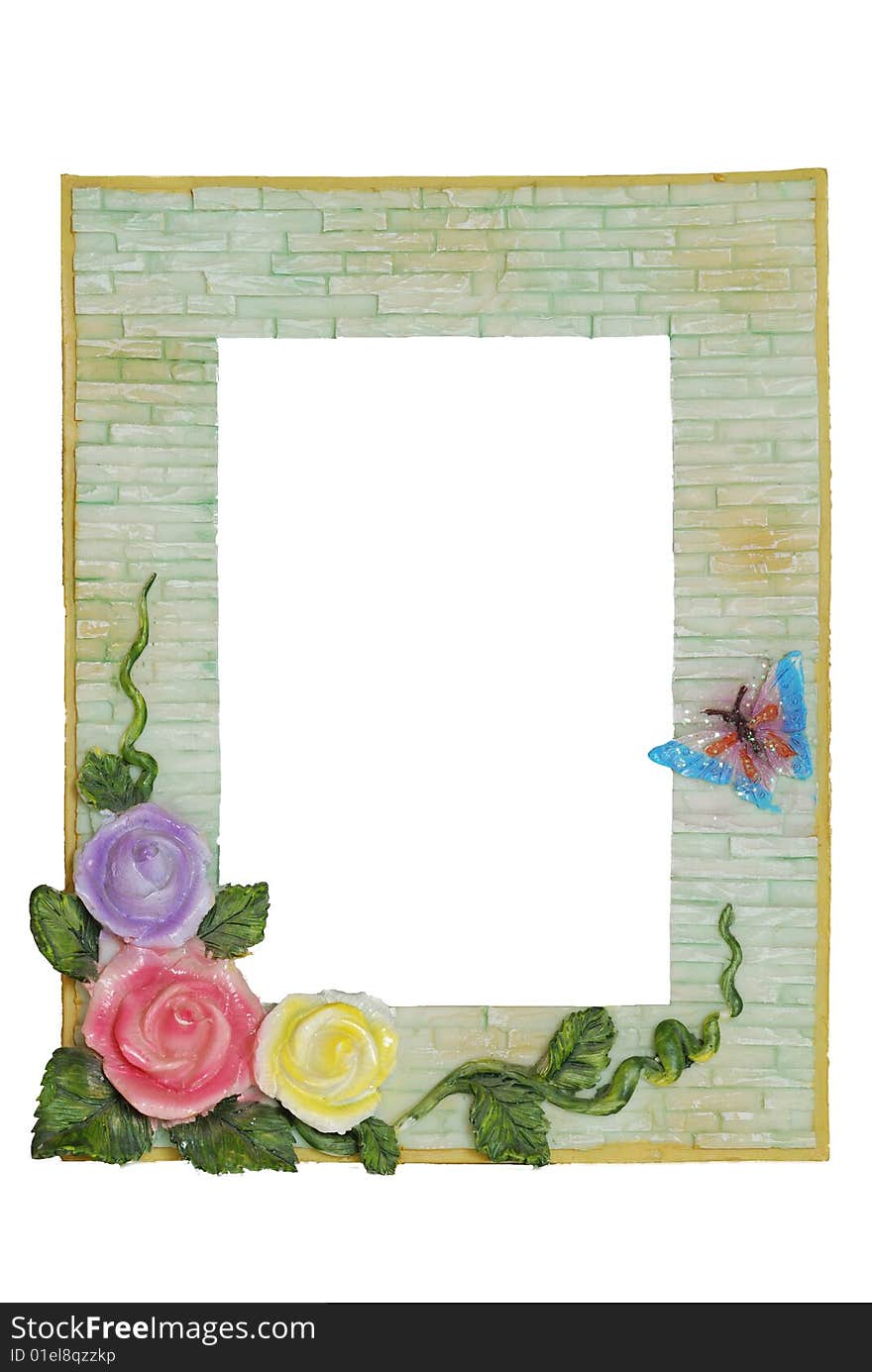 Photoframework in the form of a bricklaying and decorated with colours from roses. Photoframework in the form of a bricklaying and decorated with colours from roses