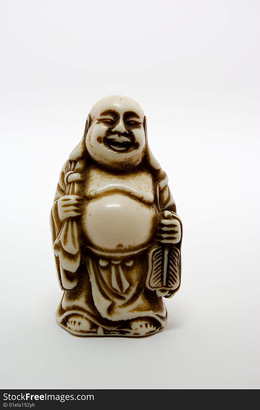 Handmade ceramic figure of Buddha on white. Handmade ceramic figure of Buddha on white