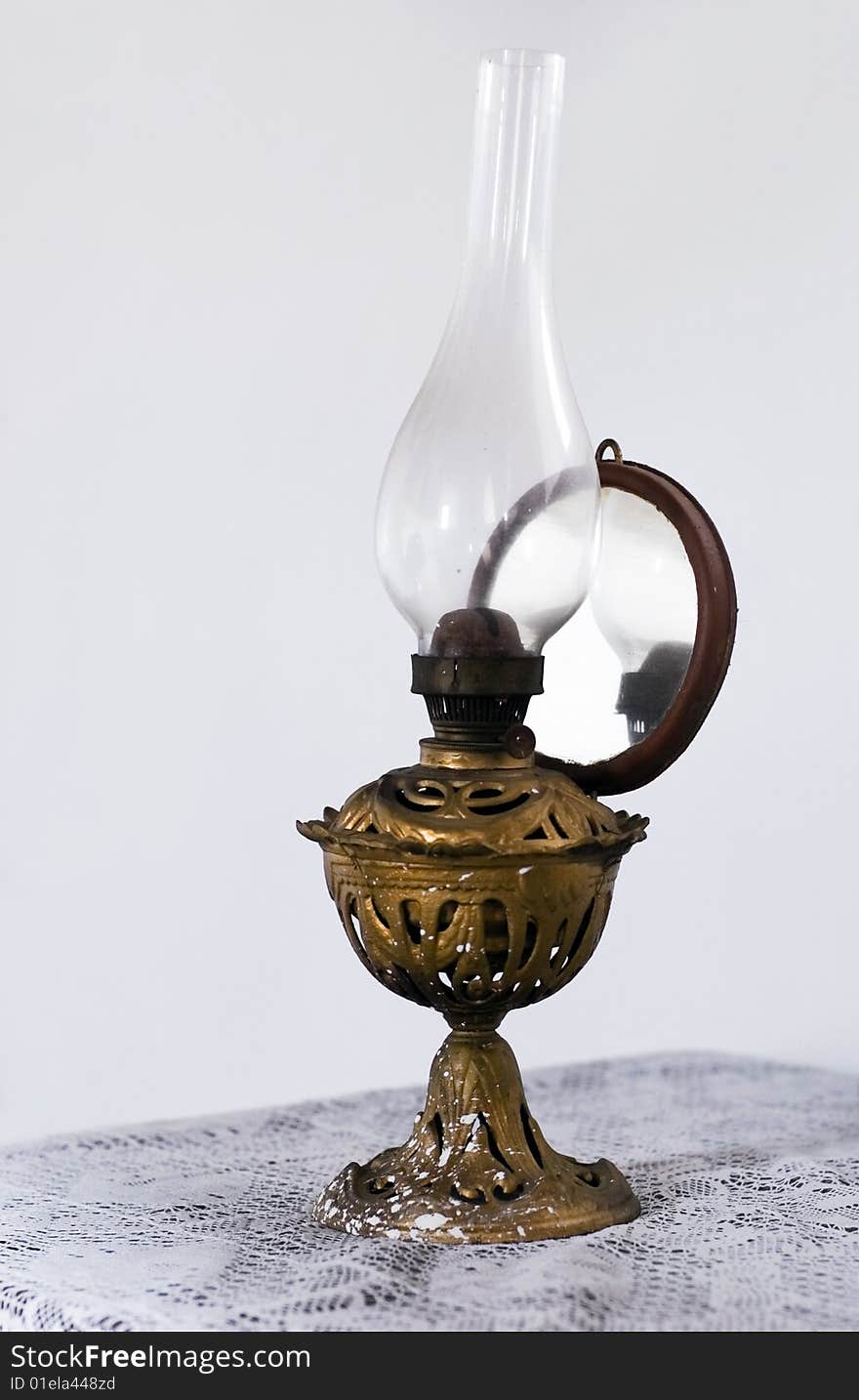 An old oil lamp laying on the table