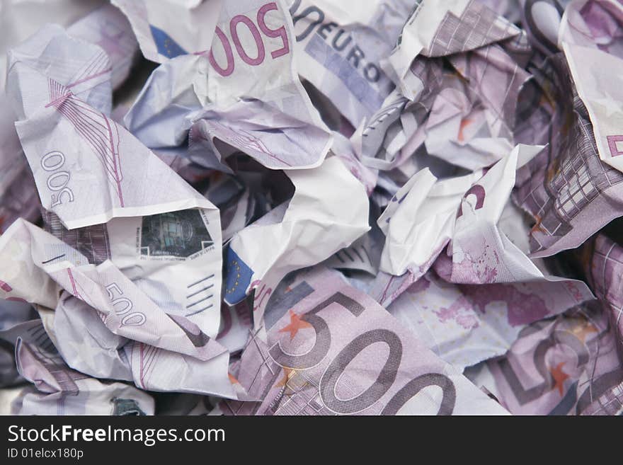 Torn Euro bills lying in heap. Torn Euro bills lying in heap