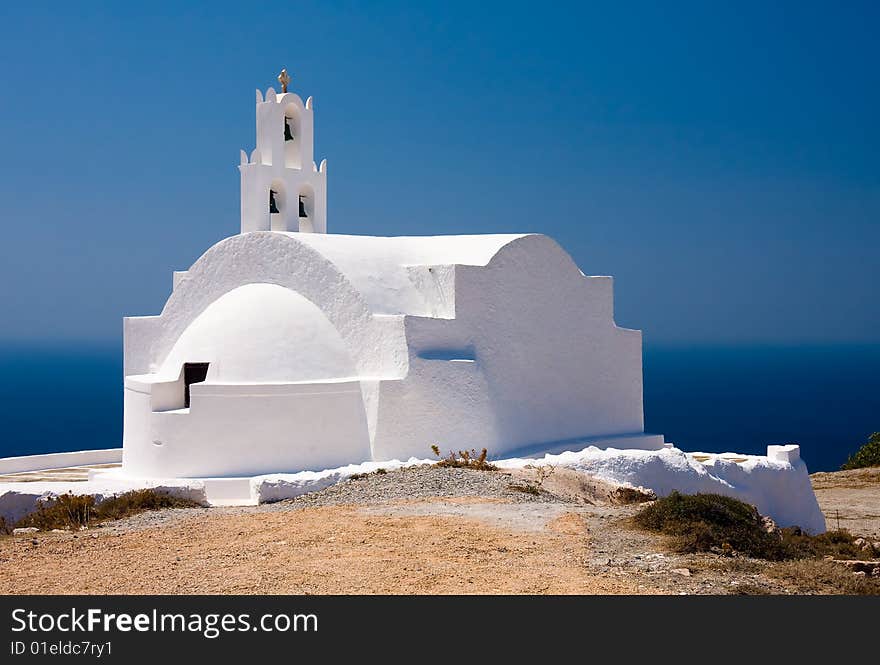 Beautiful church in front of the sea and blue sky