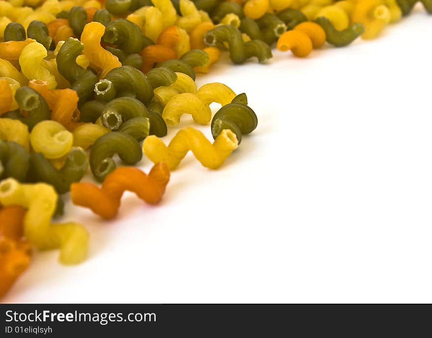 Colorful noodles frame on a white background. Soft focus