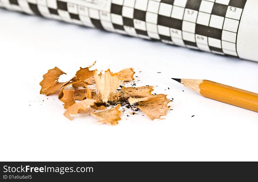 Crossword and pencil isolated on white background. Crossword and pencil isolated on white background