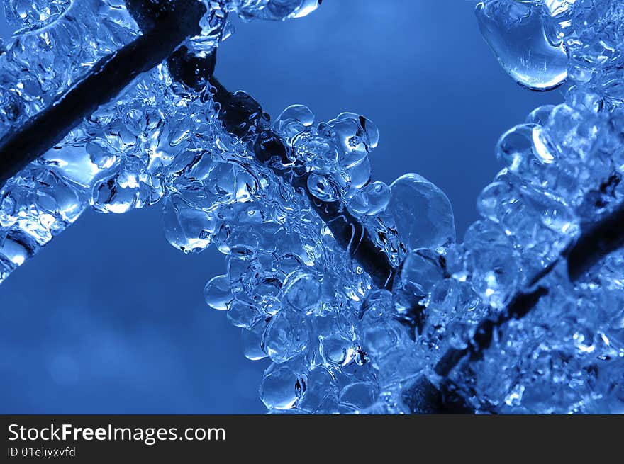 Frozen water droplets trapped on a chainlink fence. Frozen water droplets trapped on a chainlink fence