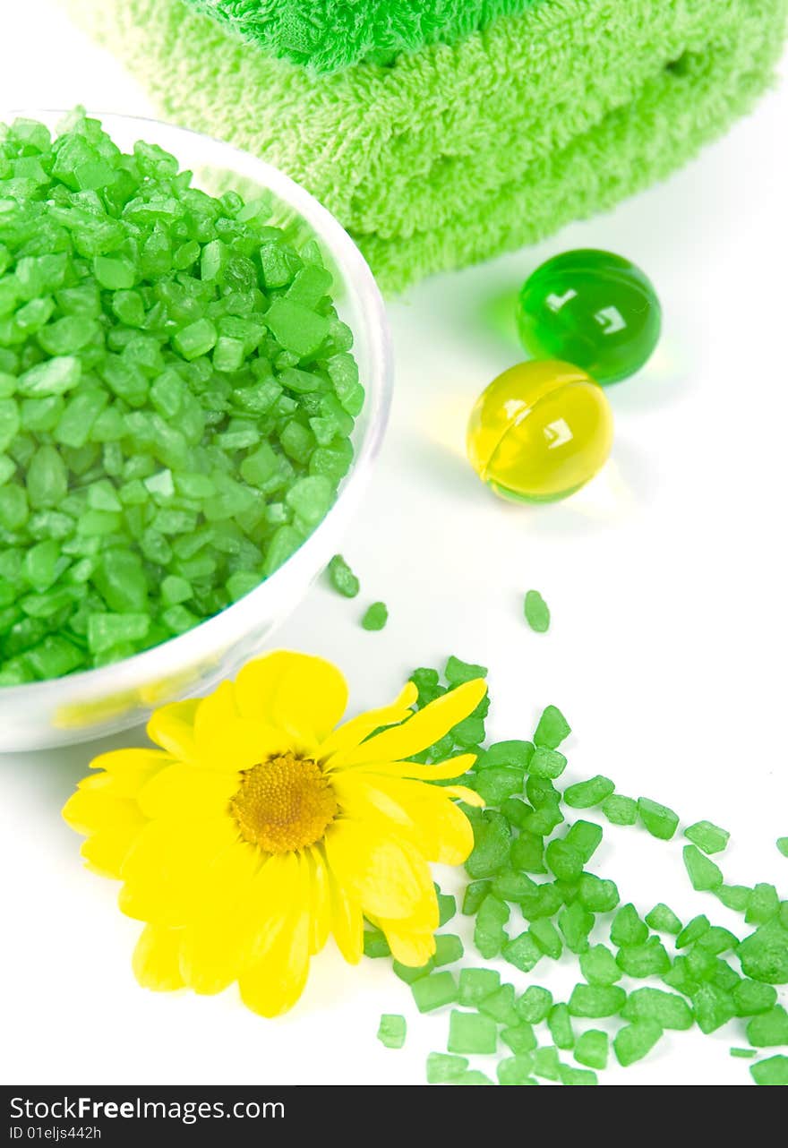 Spa pruducts: bath salt, oil balls and green towells. Spa pruducts: bath salt, oil balls and green towells