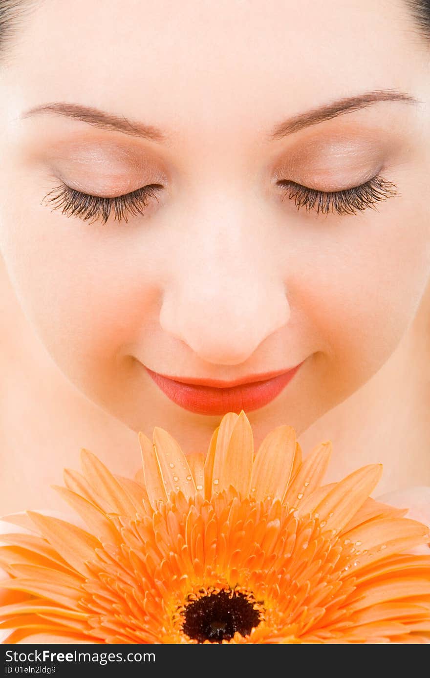 Young woman with orange flower. Young woman with orange flower