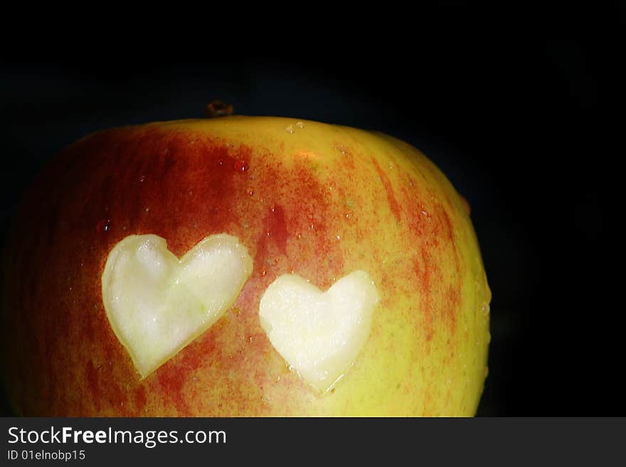 Big apple with hearts on black background. Big apple with hearts on black background