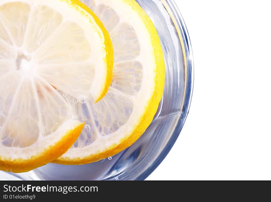 Glass full of water or another drink with lemon. Glass full of water or another drink with lemon