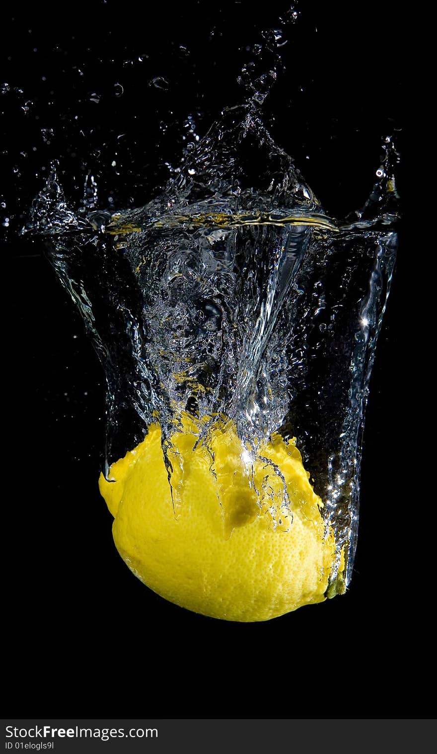 Lemon in water with bubbles on black ground. Lemon in water with bubbles on black ground