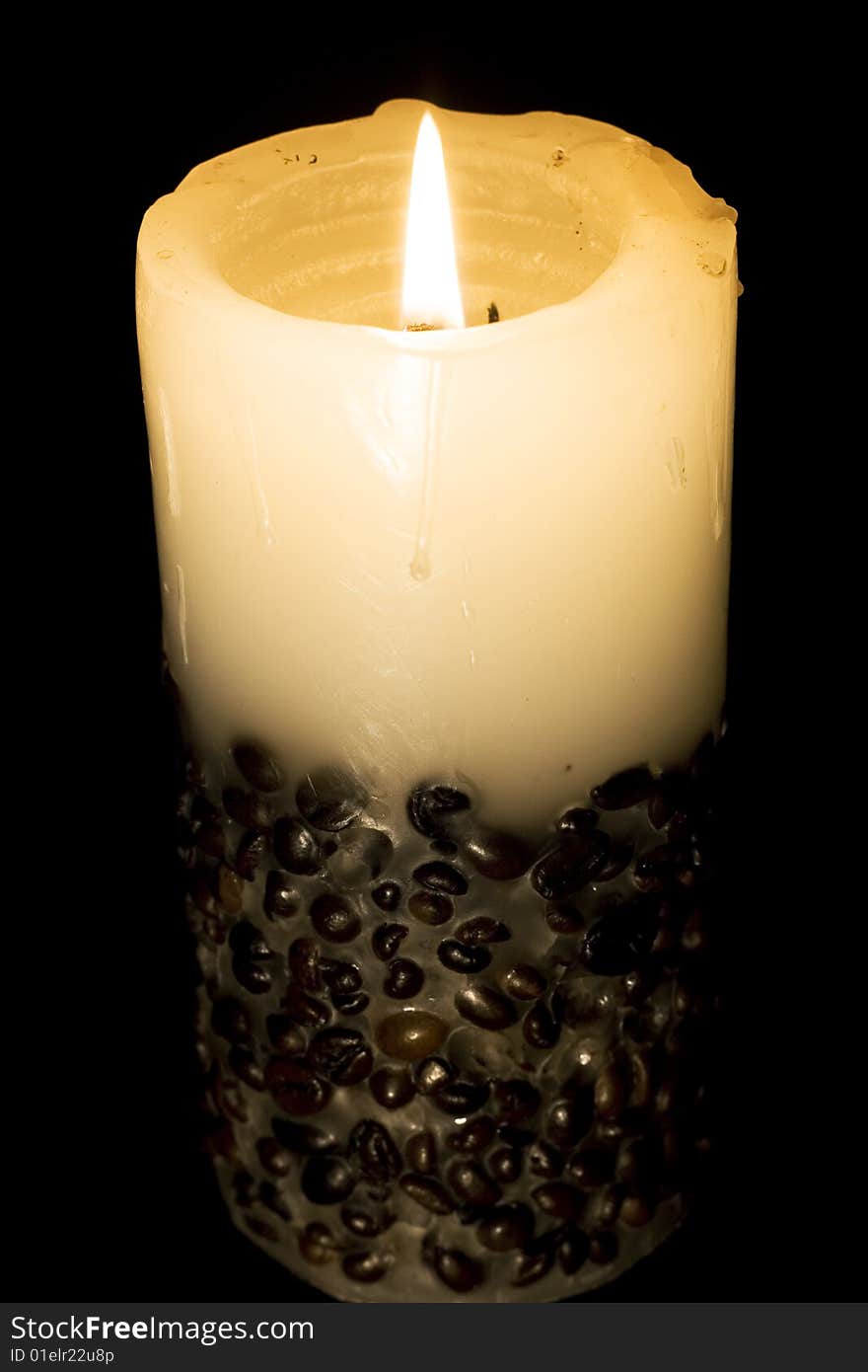 Candle isolated on black background