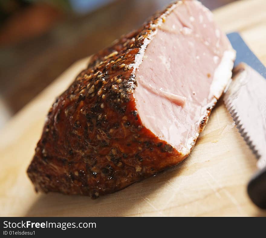 Piece of meat and a knife on wood. Piece of meat and a knife on wood