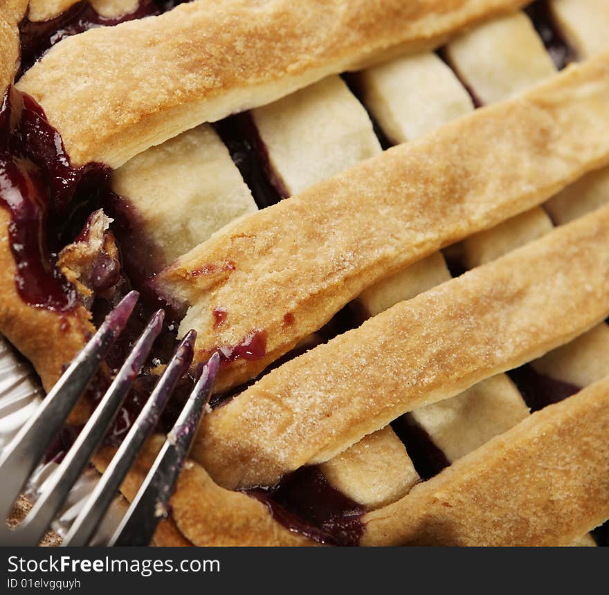 Close shot of a pie and ustensil. Close shot of a pie and ustensil