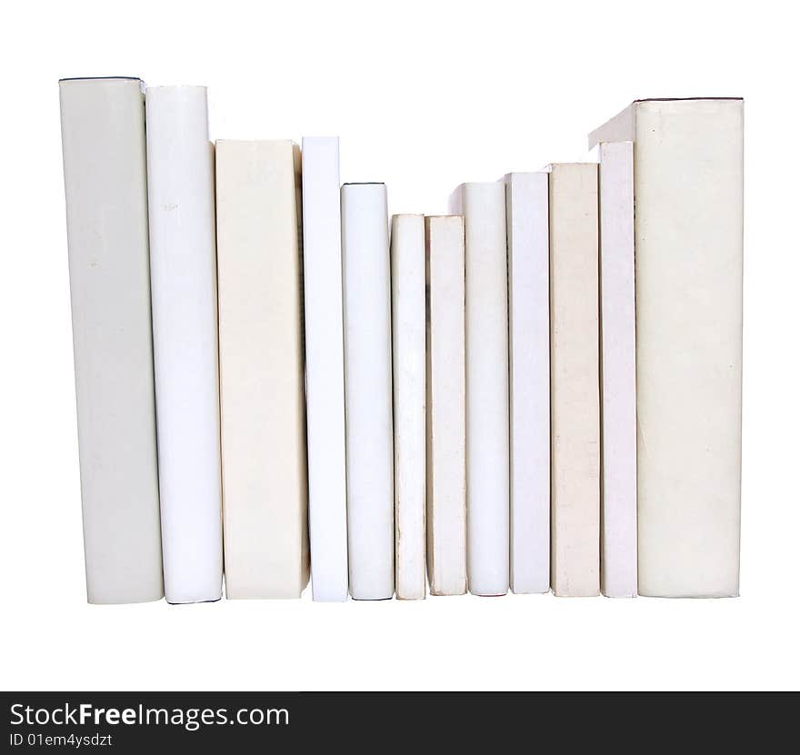 Row of white books with one red book isolated on a white background