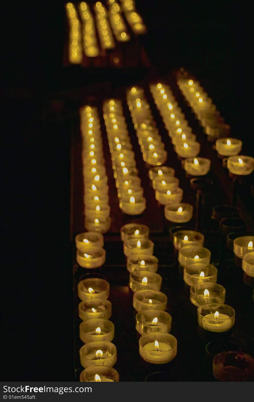 Burning Candles in several rows. Burning Candles in several rows