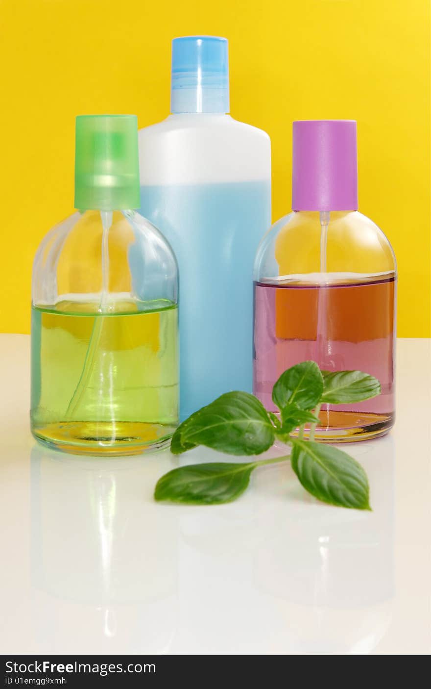 Perfumery bottles on a color background