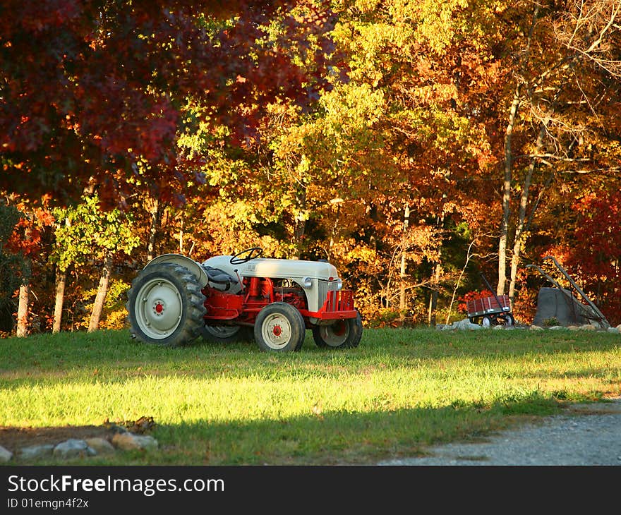 Red and Grey Vintage Tractor in the Fall. Red and Grey Vintage Tractor in the Fall