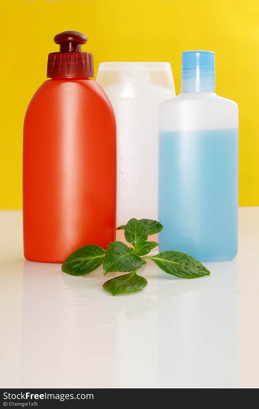 Perfumery bottles on a color background