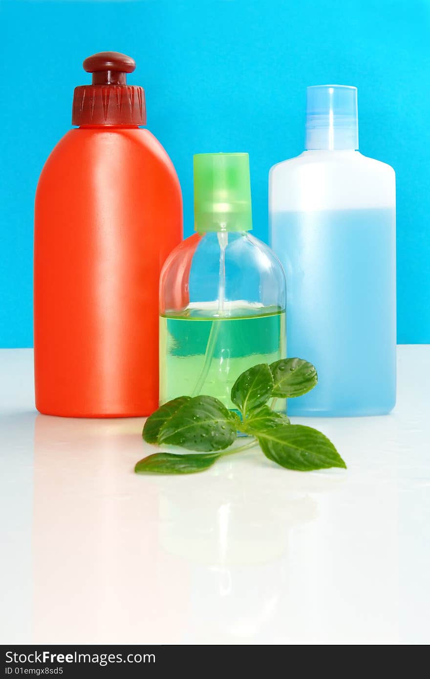 Perfumery bottles on a color background