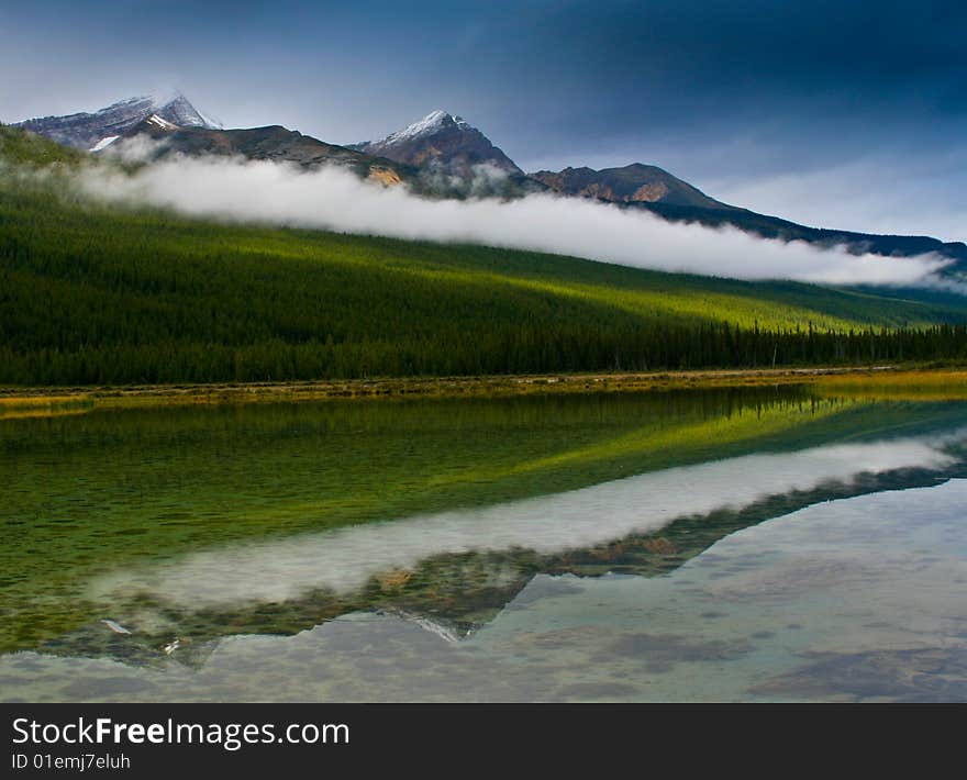 Reflection of Canadian Rockies in crystal clear lake. Reflection of Canadian Rockies in crystal clear lake