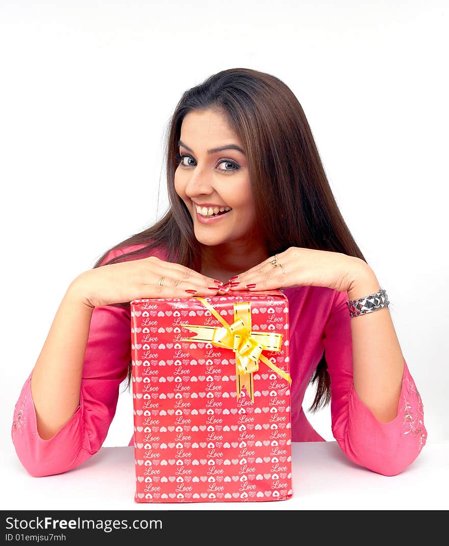 Beautiful young indian asian woman with a gift box