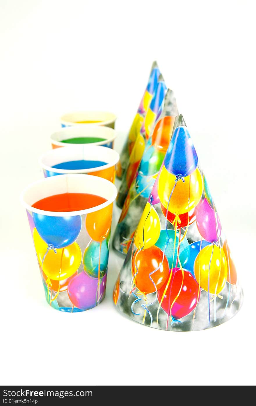 Party cups and hats isolated against a white background. Party cups and hats isolated against a white background