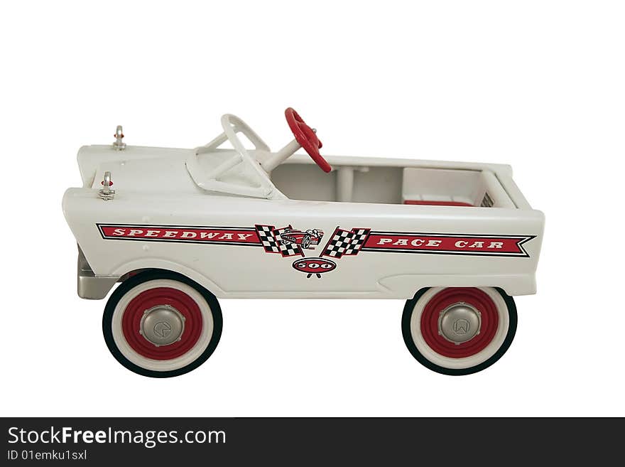 An antique pedal car replica of a speedway pace car. An antique pedal car replica of a speedway pace car