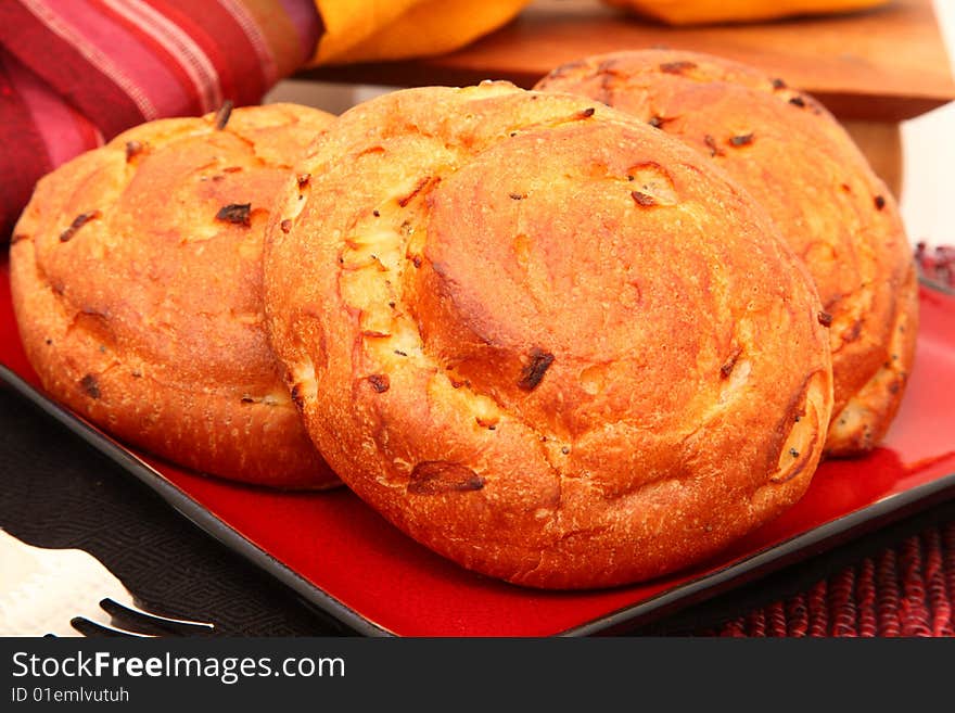 Plate of onion rolls in a plate.