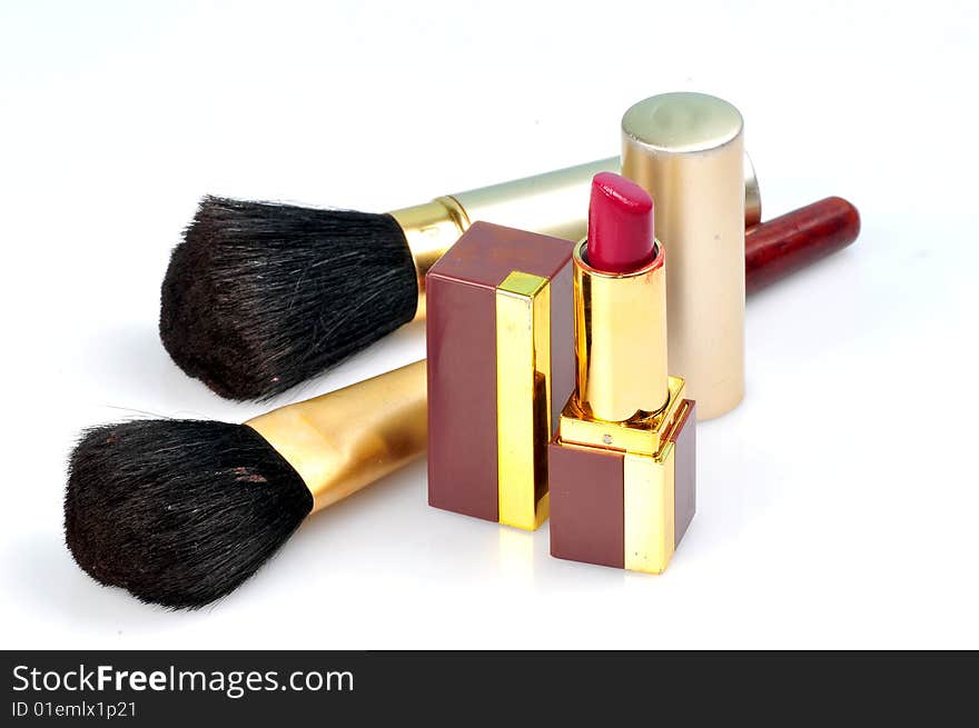 Makeup brushes and lipsticks isolated on white. Makeup brushes and lipsticks isolated on white.