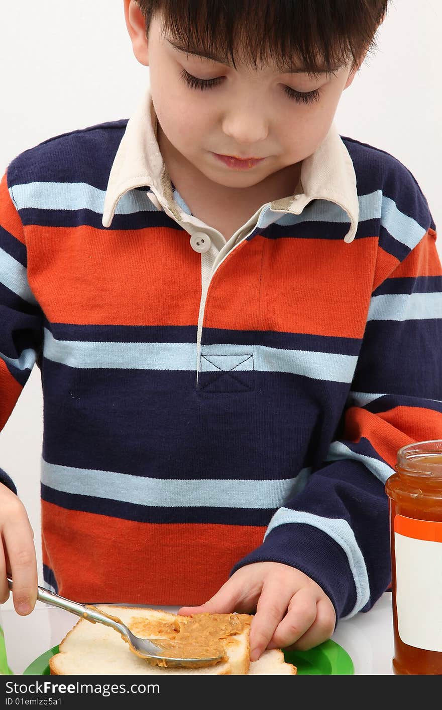 Boy Making Peanut Butter and JElly