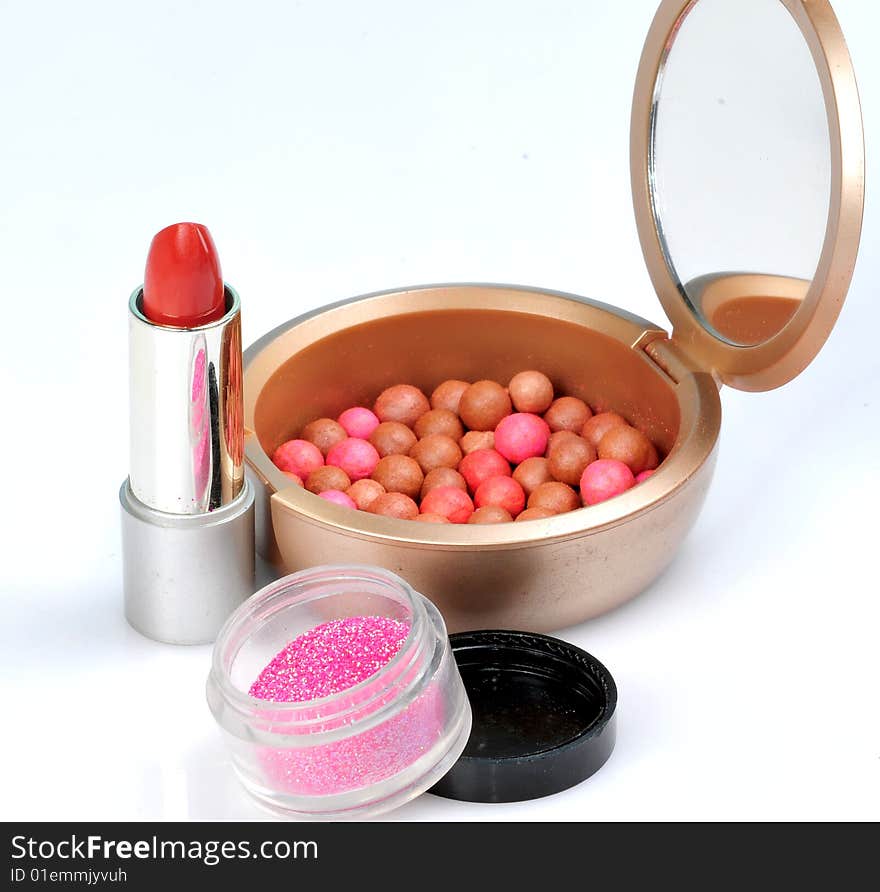 Lipsticks and shade balls isolated on white. Lipsticks and shade balls isolated on white.