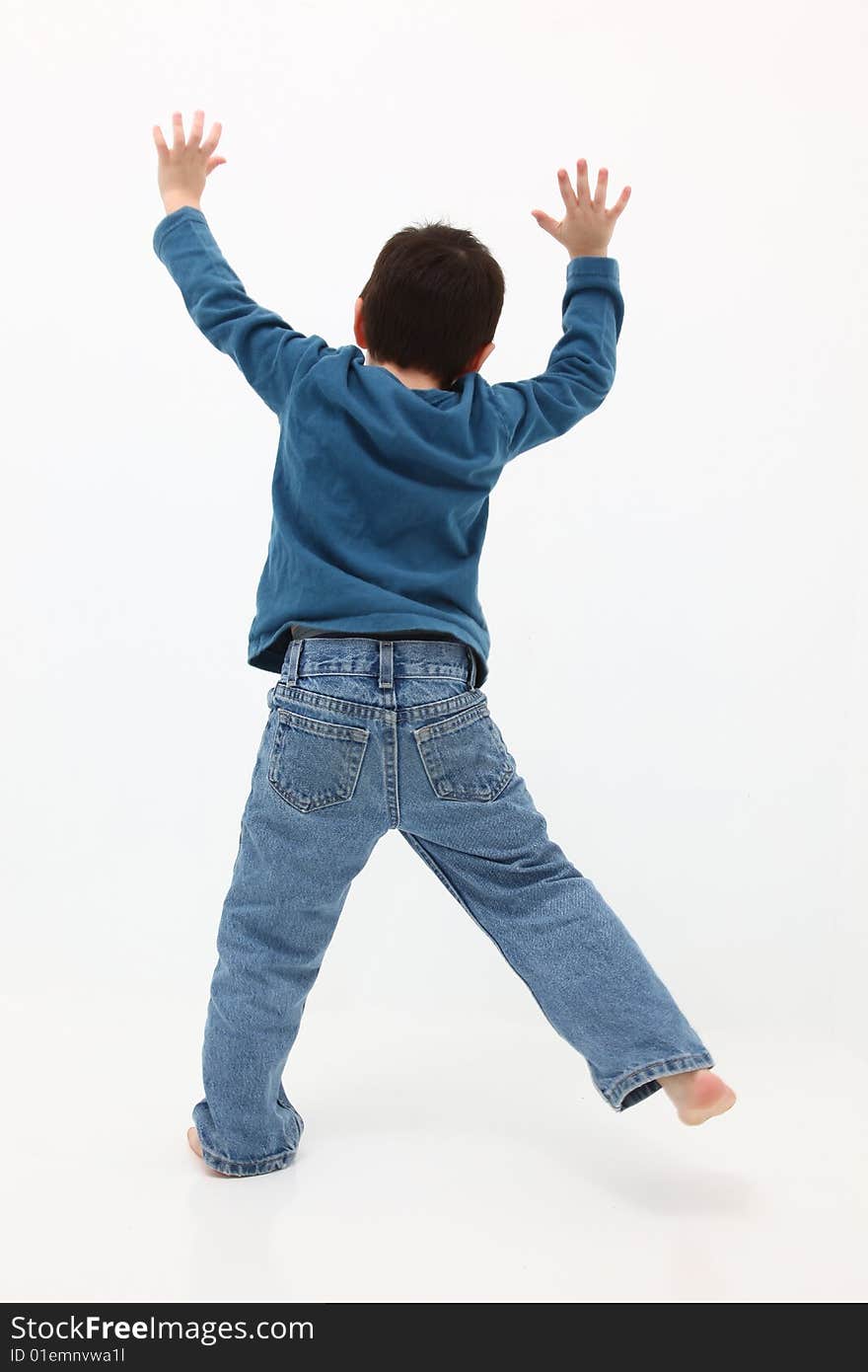 Adorable five year old boy jumping around over white. Adorable five year old boy jumping around over white.