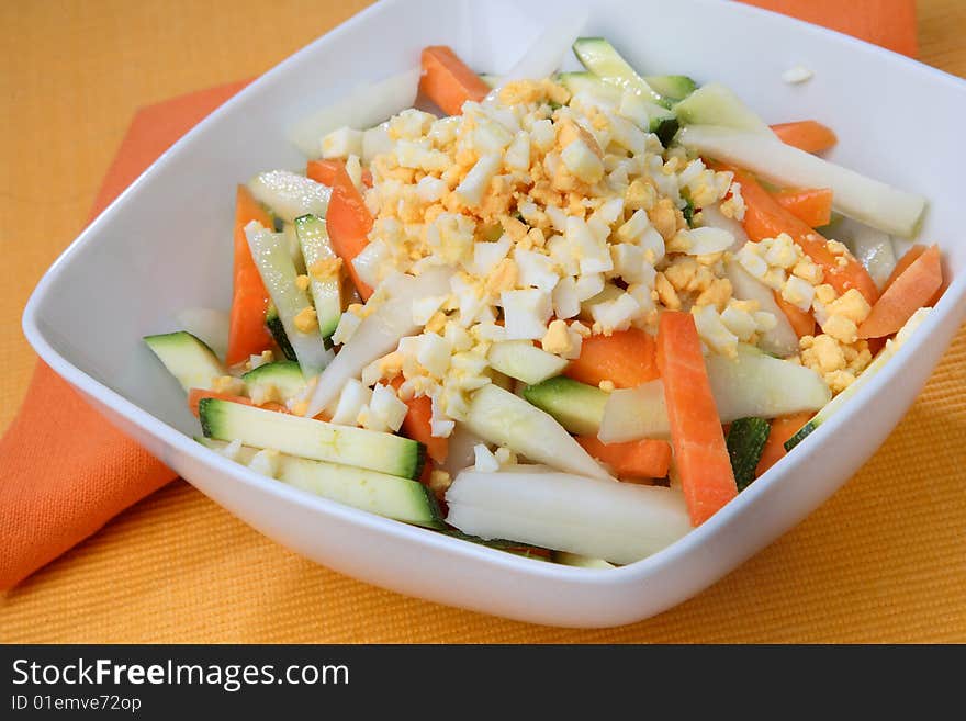 Boiled egg cubes with fresh vegetable