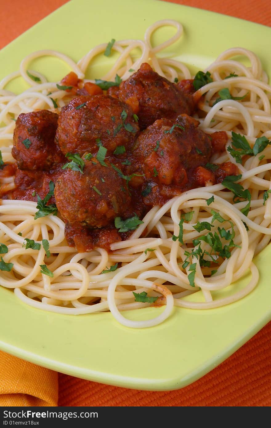 Turkey meat balls in sauce with spaghetti and herb