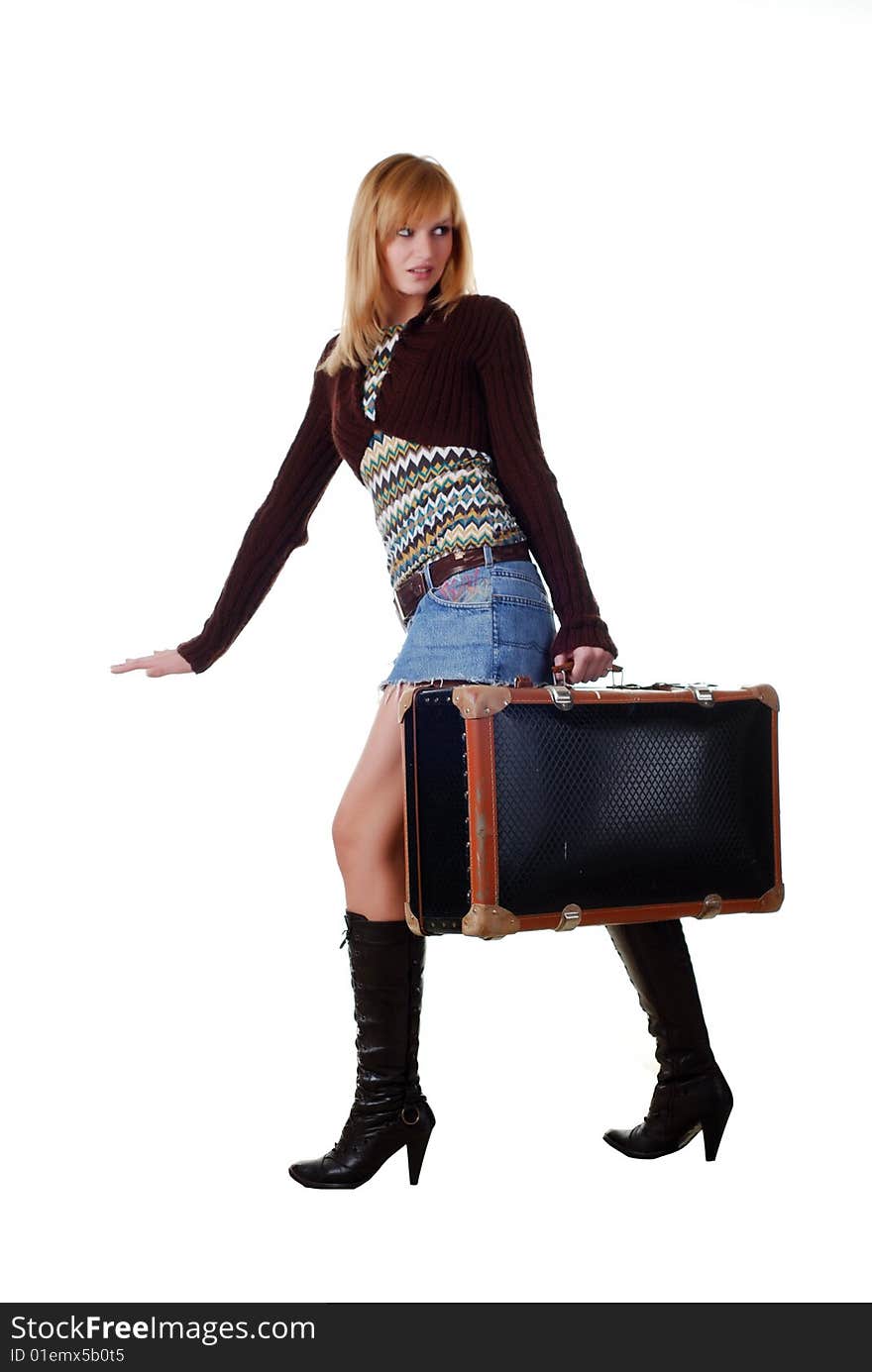 Portrait of a beautiful blond woman sitting on a travelling bag. Portrait of a beautiful blond woman sitting on a travelling bag