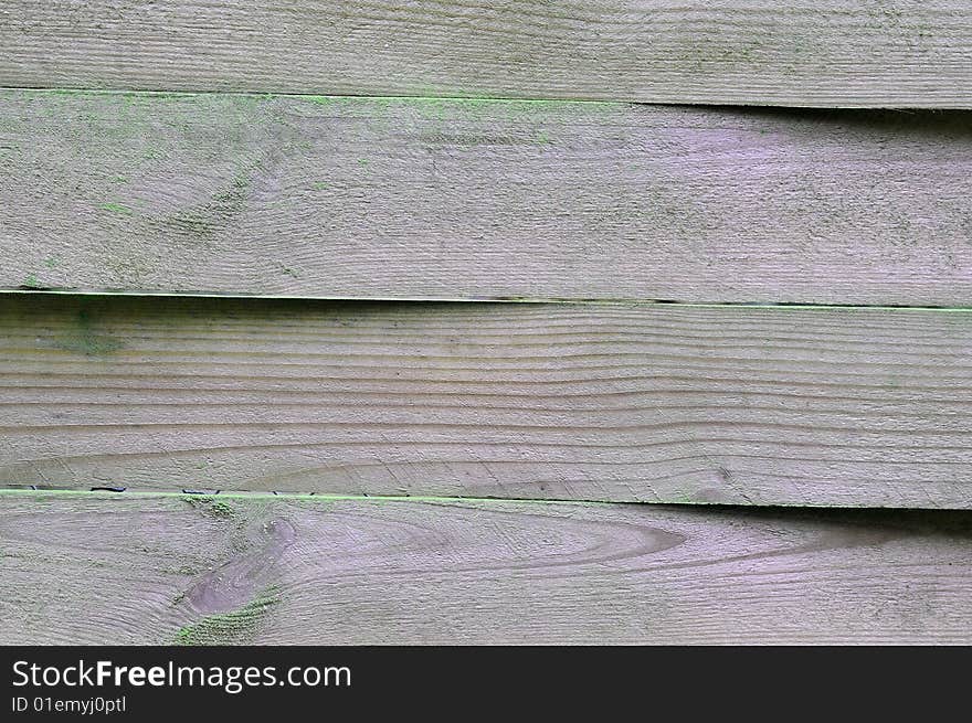 Part of a old fence,made of wood.