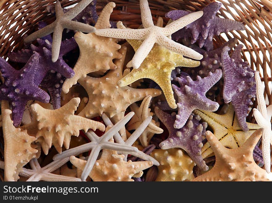 Basket with starfishes, can be used as a background