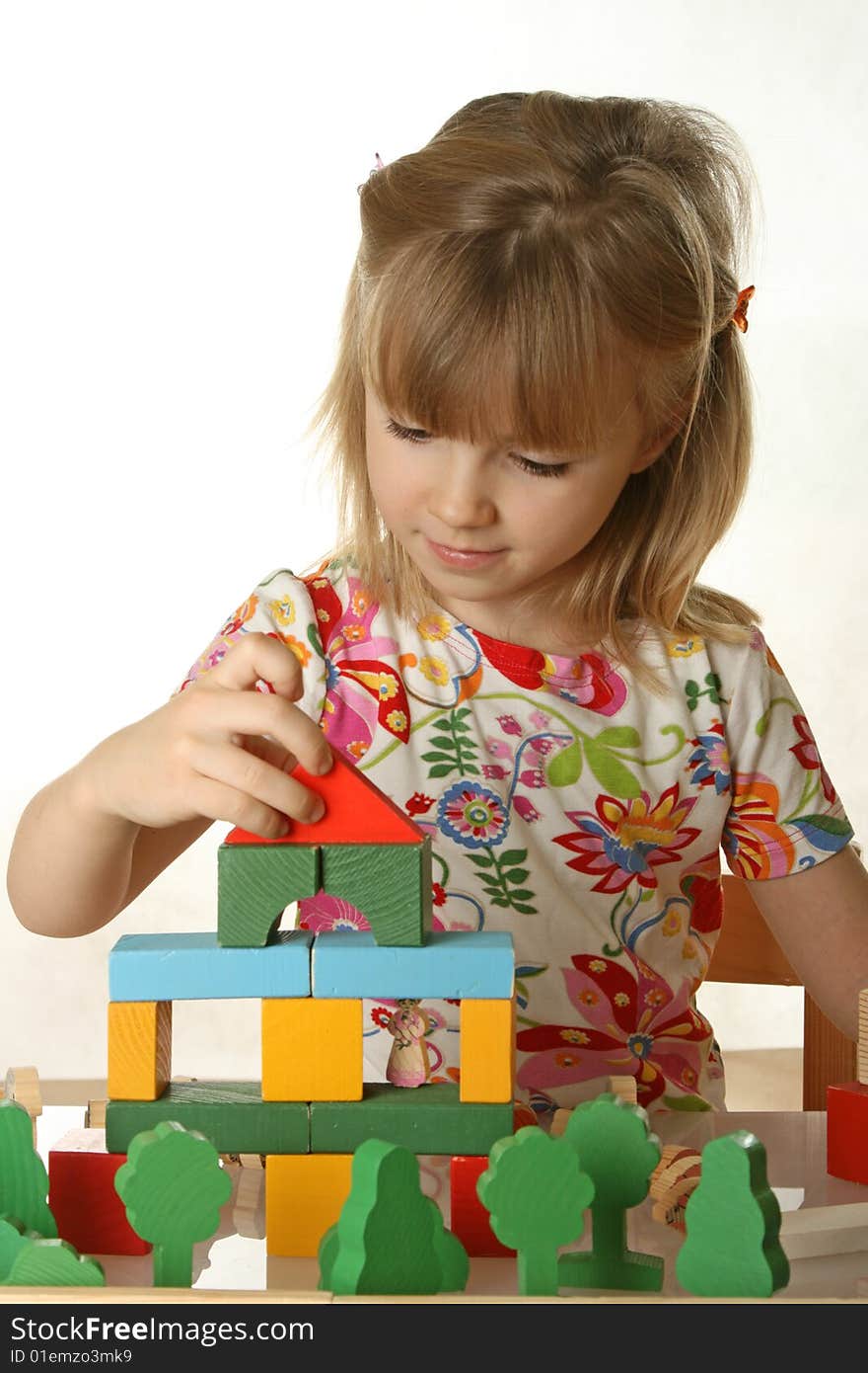 Little girl playing with cubes