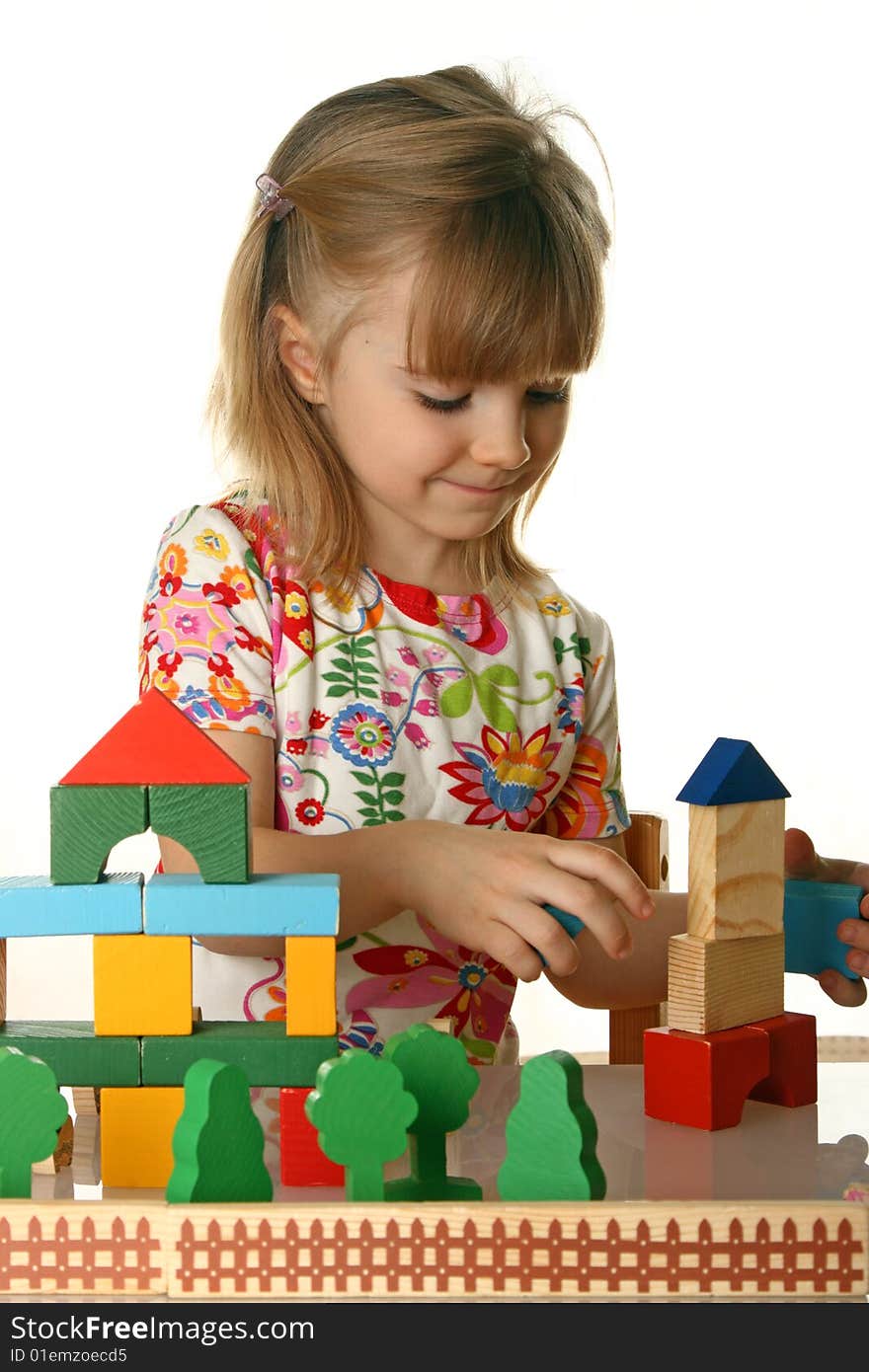 Little girl playing with cubes