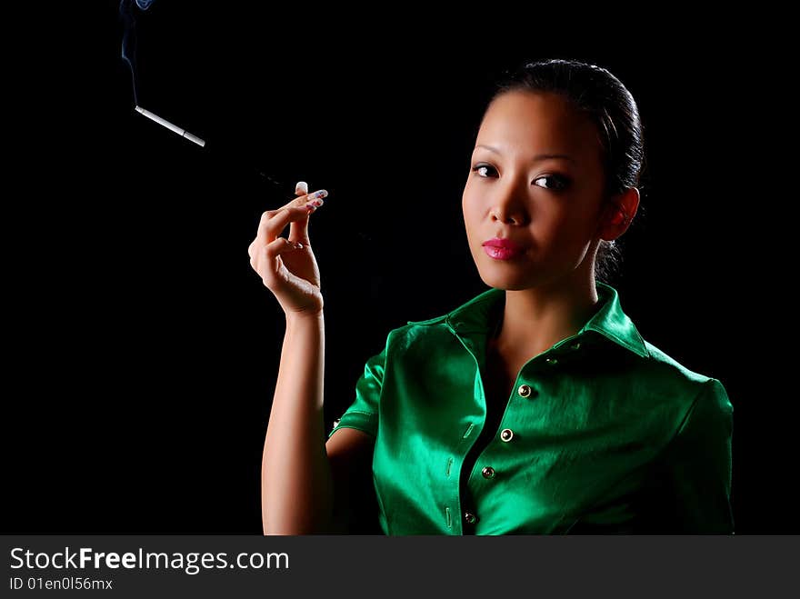 Portrait of a beautiful young woman with cigarette