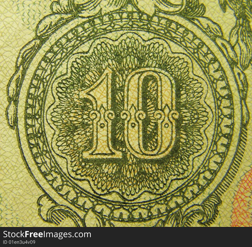 Ten on the fragment of old banknotes