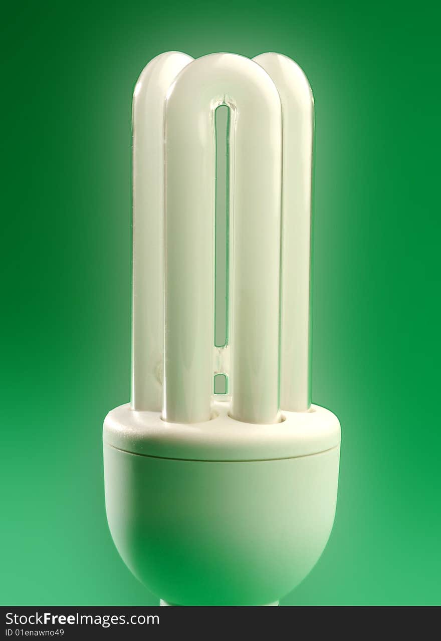 New energy saving Light bulb on a green background