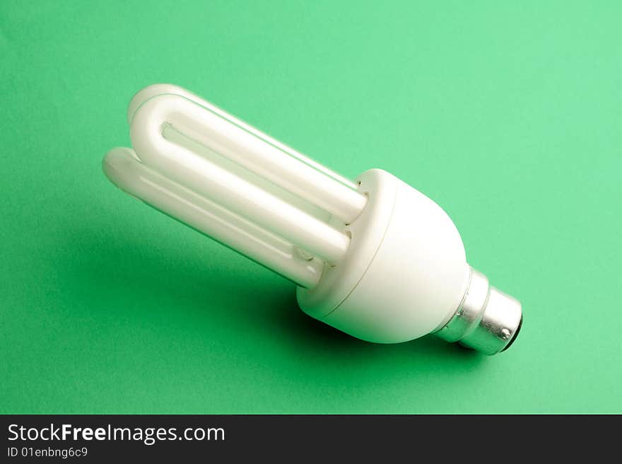 New energy saving Light bulb on a green background