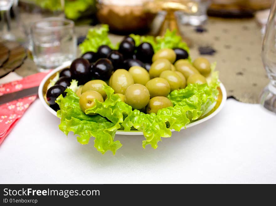 Closeup image of green and black olive