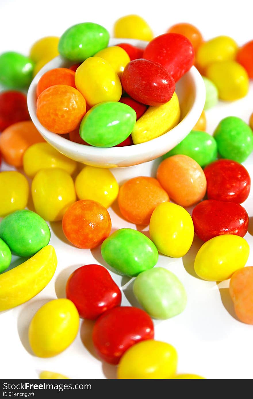 An image of multicolored candies over white