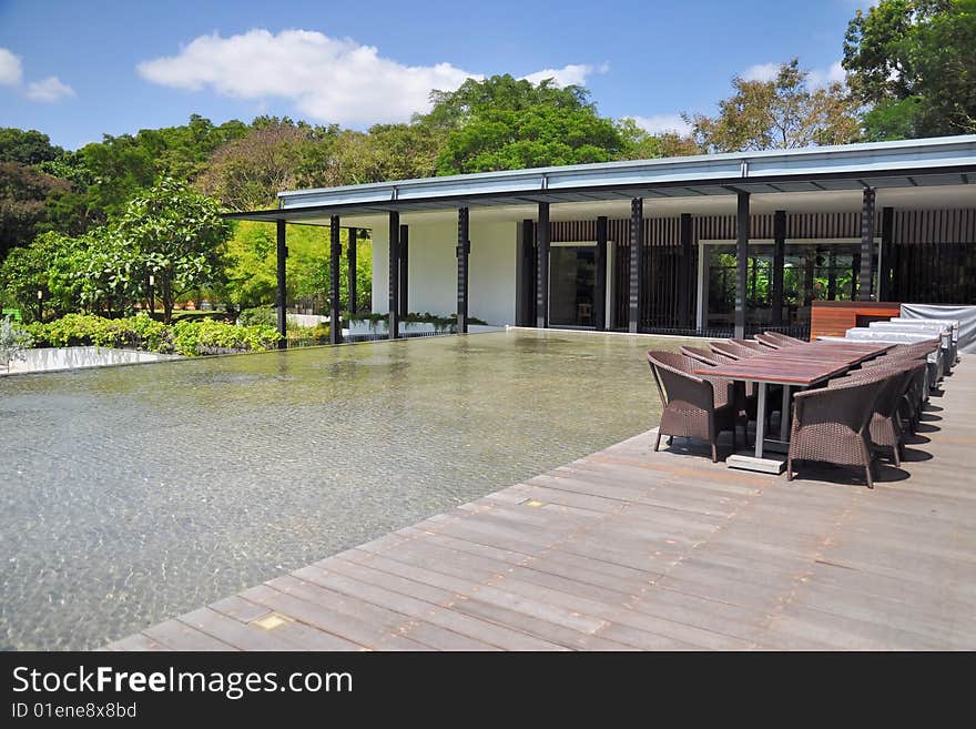 Outdoor dining place beside pond