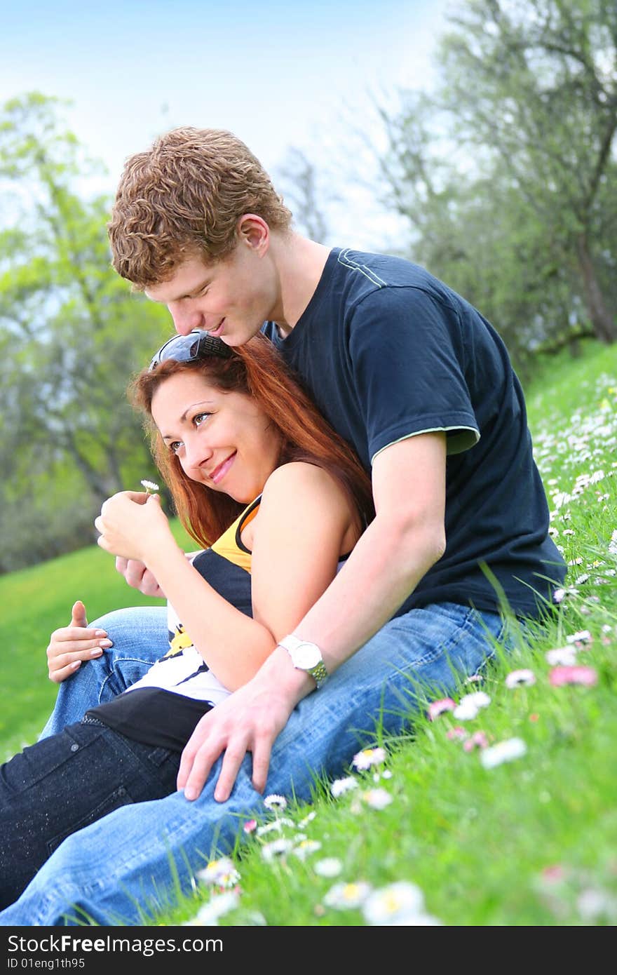 Happy young couple relaxing outdoors. Happy young couple relaxing outdoors